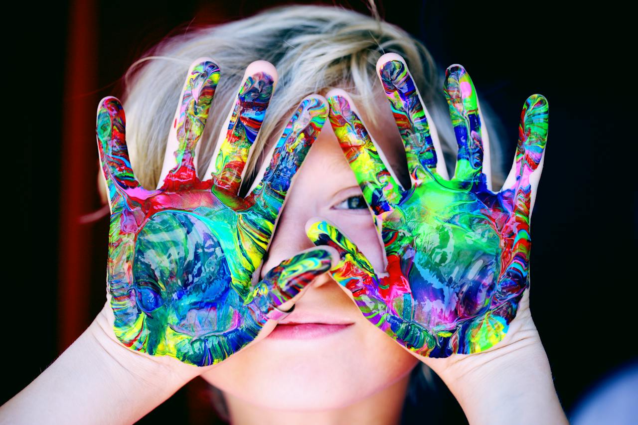 Child with coloured hannds